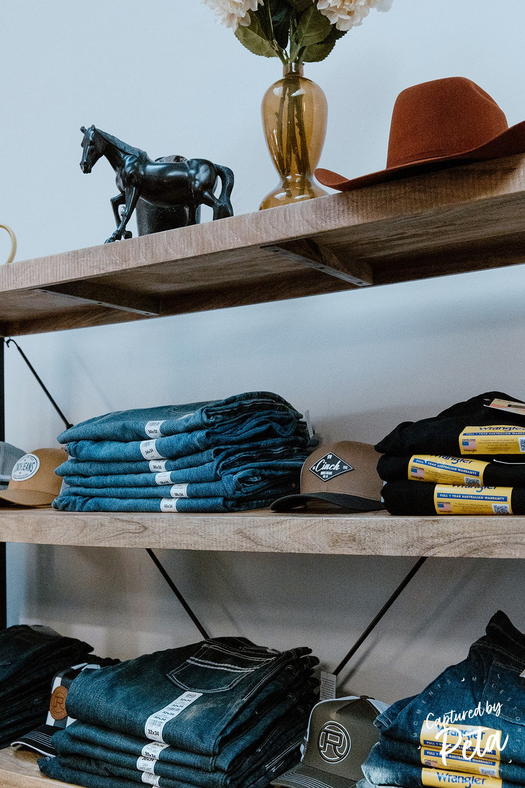 Blue denim jeans hanging in a row